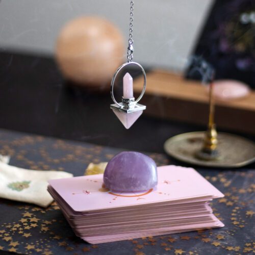 Pendulum over crystal and cards